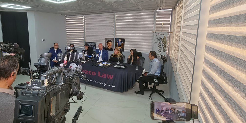 Press conference at the Carrazco Law office: the Garcia family with Angel Carrazco, Jr. and Kent M. Henderson, facing television cameras